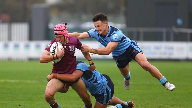 Braithen Scott is tackled by NSWÃ&#149;s alex Isdale. Picture: Tertius Pickard