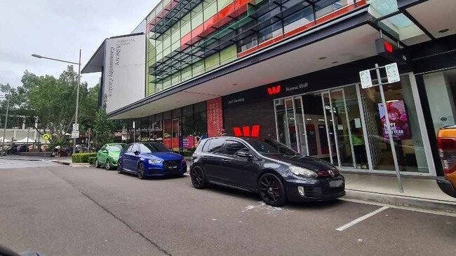 The scene where the 22-year-old alleges he was attacked - the yogurt spilled on the ground in the incident can still be seen by the car. Picture: Supplied.