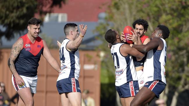 Fighting for the ball. Picture: Andrew Batsch