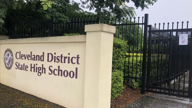 The front gate at Cleveland District State High remains locked with those seeking refuge forced to call the local council for the key to get into the shelter. Picture: JUDITH KERR