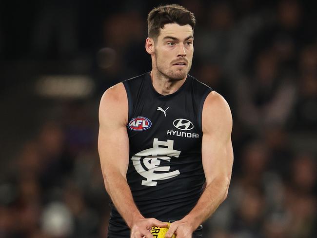 MELBOURNE, AUSTRALIA - MAY 13: George Hewett of the Blues runs with the ball during the round nine AFL match between Carlton Blues and Western Bulldogs at Marvel Stadium, on May 13, 2023, in Melbourne, Australia. (Photo by Robert Cianflone/Getty Images)