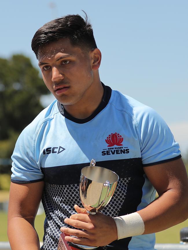 Tyrese Lokeni of NSW receives his sides trophy.