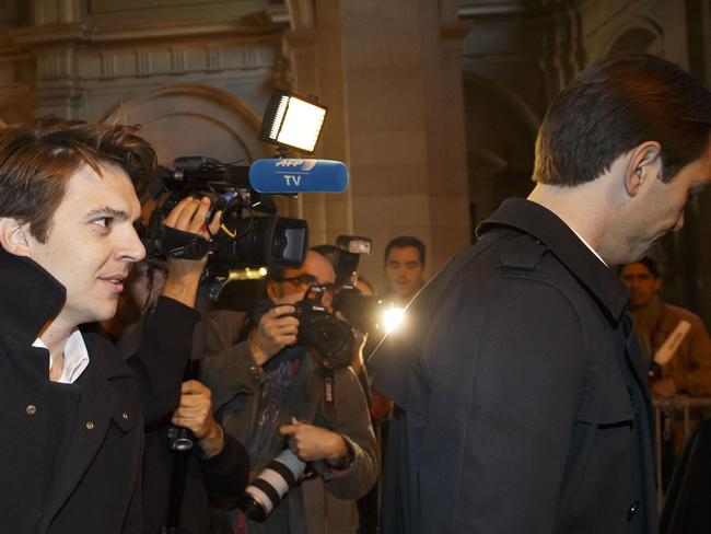 Pierre-Dimitri Gore-Coty, general manager for western Europe of California-based Uber, left, and Thibaud Simphal, manager of Uber France, right arrive at the court house in Paris, France, Wednesday, Sept. 30, 2015. Two Uber executives are facing the possibility of prison in a trial hinging on the ride-hailing service's outlawed low-cost service. The trial Wednesday of Pierre-Dimitri Gore-Coty and Thibaud Simphal, comes a week after France's top constitutional authority upheld a 2014 law banning the low-cost UberPop service, which allowed any driver to act as a taxi. Uber's standard app-based service remains legal in France. (AP Photo/Michel Euler)