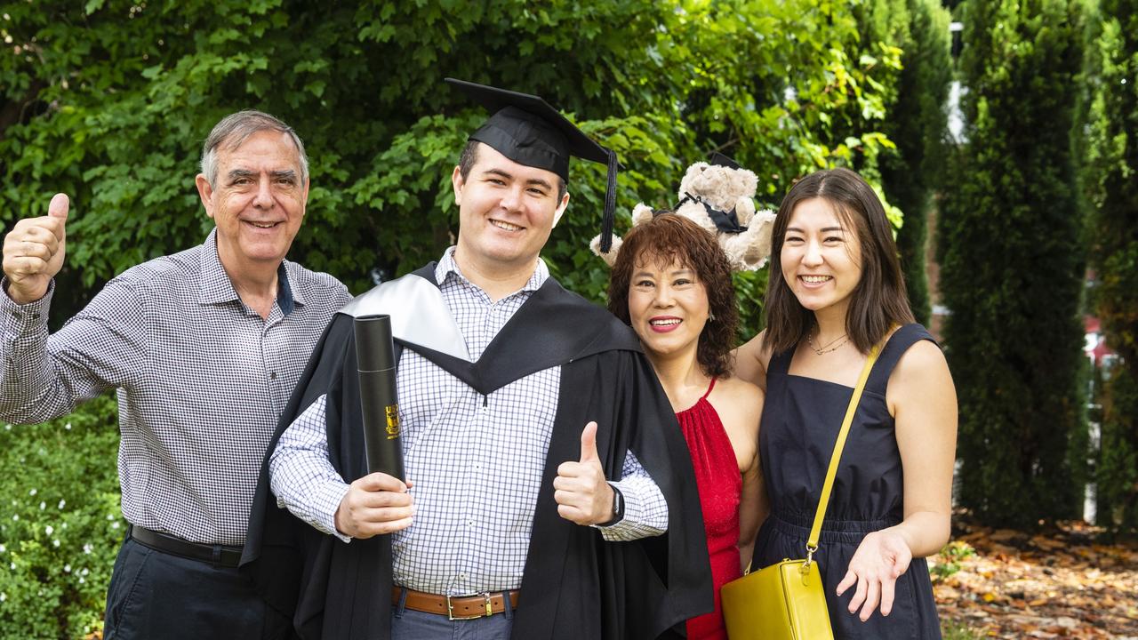 James Hearn (Bachelor of Business) is congratulated by Michael Fardouly, Lydia Hearn and Ellis Hearn (right) at the UniSQ graduation ceremony at Empire Theatres, Tuesday, December 13, 2022. Picture: Kevin Farmer