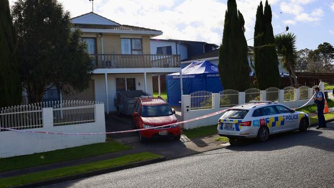 Police at the scene where the two children’s bodies were discovered. Picture: Jed Bradley/NZ Herald