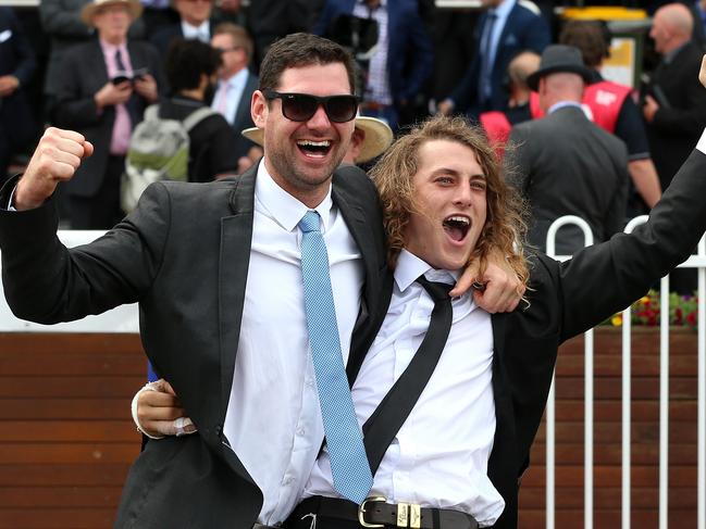 Part owners of Amovatio celebrate in the mounting yard after winning Race Four the Weekend Hussler Stakes during the Beck Caulfield Guineas Race Day at Caulfield Racecourse on Saturday 10th October, 2015. Picture: Mark Dadswell