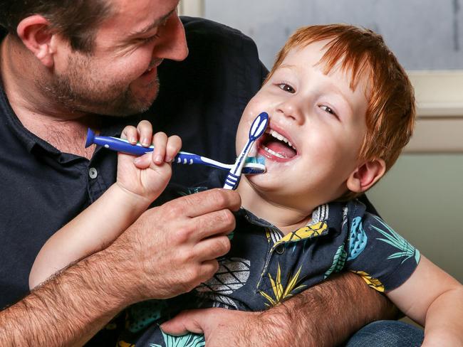 Three-year-old Jack Ryan brushes his teeth with dad Dan. Picture: Tim Carrafa