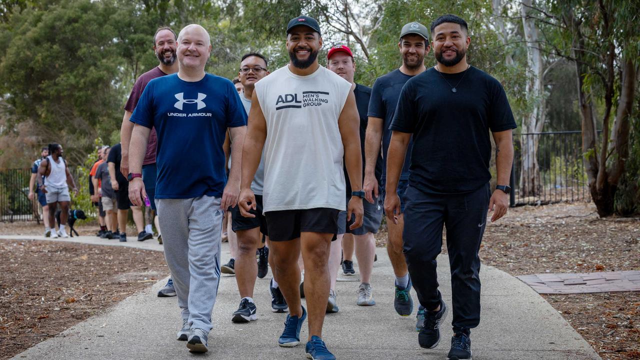 Adelaide Men's Walking group organiser Matthew McCurry with founders Timani and John Seve. Newton. Picture: Emma Brasier