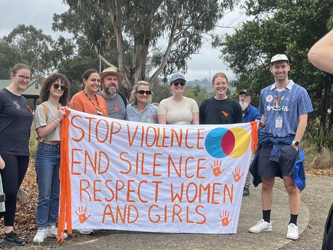 Several attendees held up signs and wore orange at the event. Picture: Erin Constable