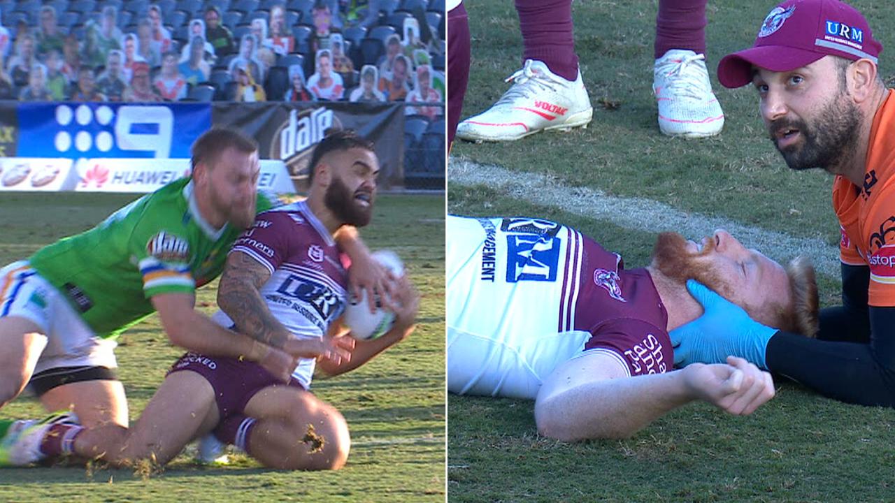 Dylan Walker and Brad Parker go down for the Sea Eagles on the Campbelltown surface.