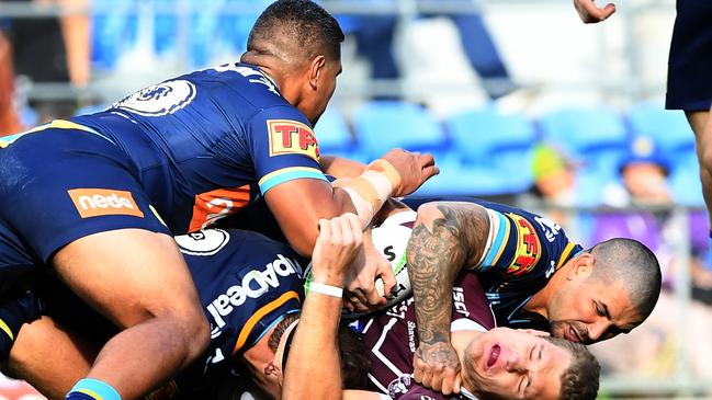 Peats and Moeaki Fotuaika tackle Manly fullback Tom Trbojevic. Picture: AAP Image