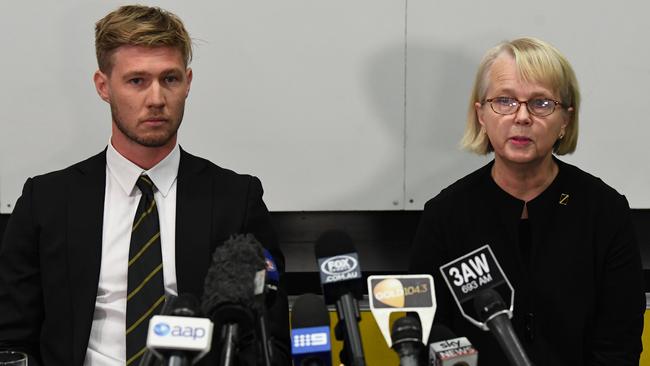 Nathan Broad and Peggy O’Neal face the media.