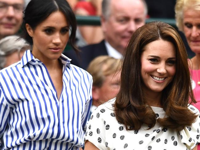 LONDON, ENGLAND - JULY 14:  Meghan, Duchess of Sussex and Catherine, Duchess of Cambridge attend day twelve of the Wimbledon Lawn Tennis Championships at All England Lawn Tennis and Croquet Club on July 14, 2018 in London, England.  (Photo by Clive Mason/Getty Images)