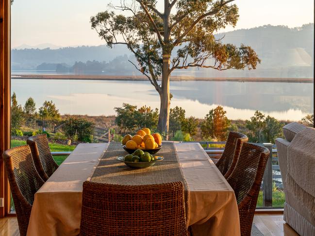 Huon River Hideaway’s dining area features stunning views from the expansive windows across to the Egg Islands and Heriots Point, south of Franklin. Picture: Jon Jarvela photographs