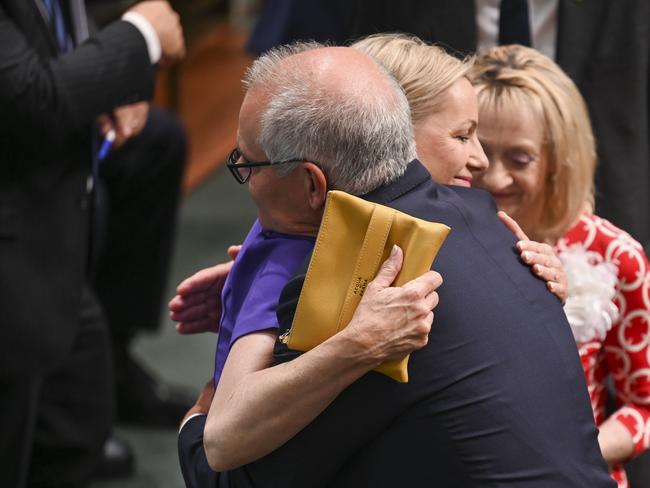 Scott Morrison is hugged by colleagues during a censure motion over the secret minister scandal at Parliament House in Canberra. Picture: NCA NewsWire / Martin Ollman