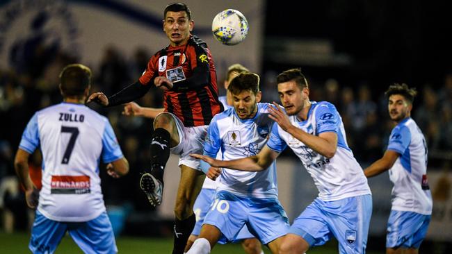 Aleksander Canak of Rockdale City beats Sydney FC players to the ball in their Round of 32 match FFA Cup game at Ilinden Sports Centre in Sydney. Picture: AAP