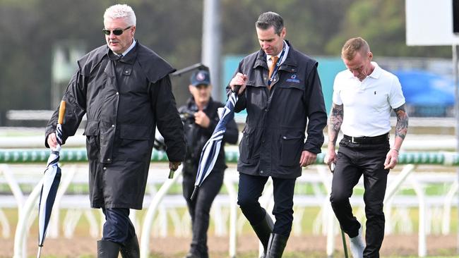 Stewards Paul Zimmerman (left) and Geoff Goold (middle) inspect the Sunshine Coast track with jockey Jim Byrne (right). Picture: Grant Peters/Trackside Photography