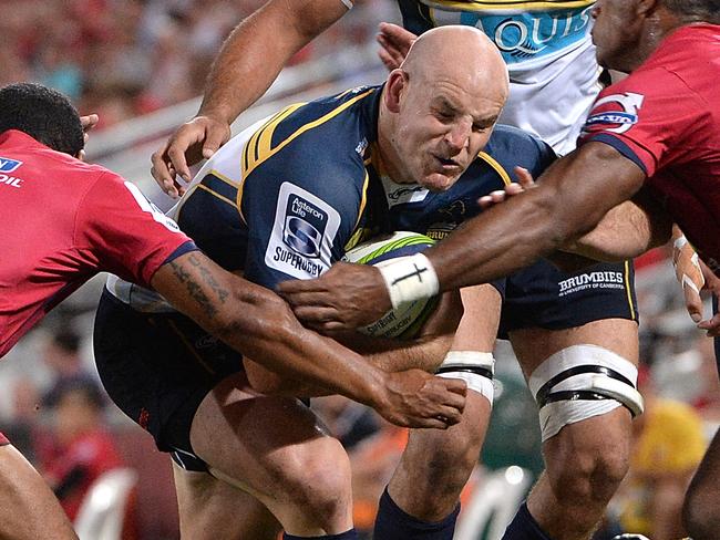 BRISBANE, AUSTRALIA - MARCH 14: Stephen Moore of the Brumbies takes on the defence during the round five Super Rugby match between the Reds and the Brumbies at Suncorp Stadium on March 14, 2015 in Brisbane, Australia. (Photo by Bradley Kanaris/Getty Images)