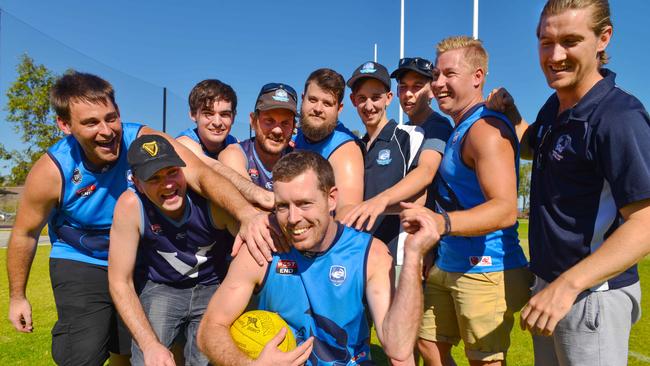 Flinders University A-grade football team president/player Dean Schofield with team-mates after losing 283-0 at the weekend. Picture: AAP / Brenton Edwards