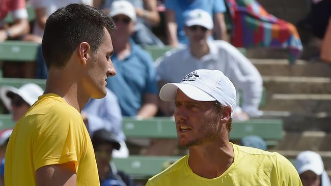 Last year Tomic’s feud with Lleyton Hewitt (R) turned toxic. Picture: AFP