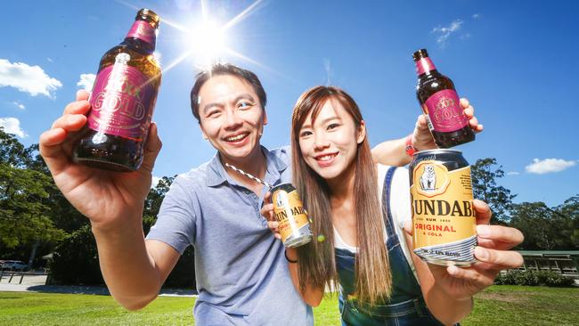 Chinese tourists Chungyi Wu and Judy Wu sinking XXXX Golds and Bundaberg Rum at Paradise Country on the Gold Coast. Picture: NIGEL HALLETT