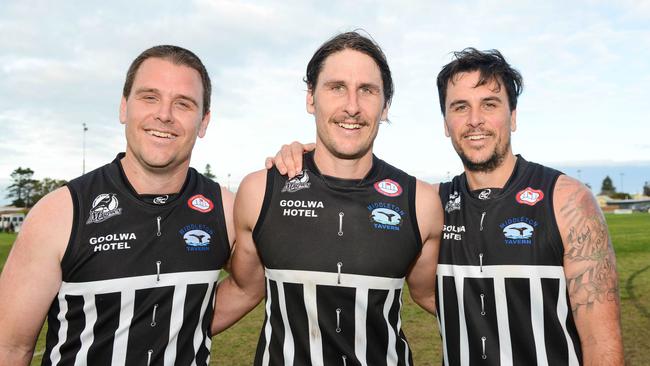 Ex-Western Bulldogs and GWS star Ryan Griffen (centre) after playing for Goolwa-Port Elliot last year with his brothers Travis (left) and Trent (right). Picture: AAP/Brenton Edwards