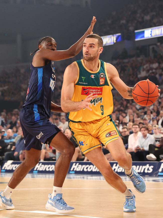 Jack Mcveigh of the JackJumpers handles the ball against Ian Clark of Melbourne United at John Cain Arena on March 31, 2024 in Melbourne, Australia. (Photo by Kelly Defina/Getty Images)