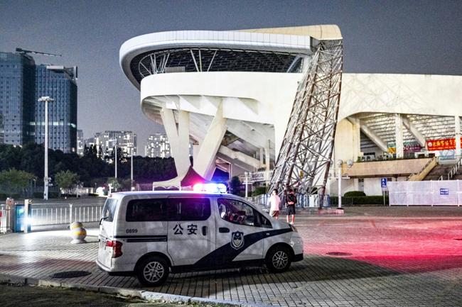 A police car is seen at the Zhuhai Sports Centre on November 12, 2024, a day after a car rammed through the site killing dozens