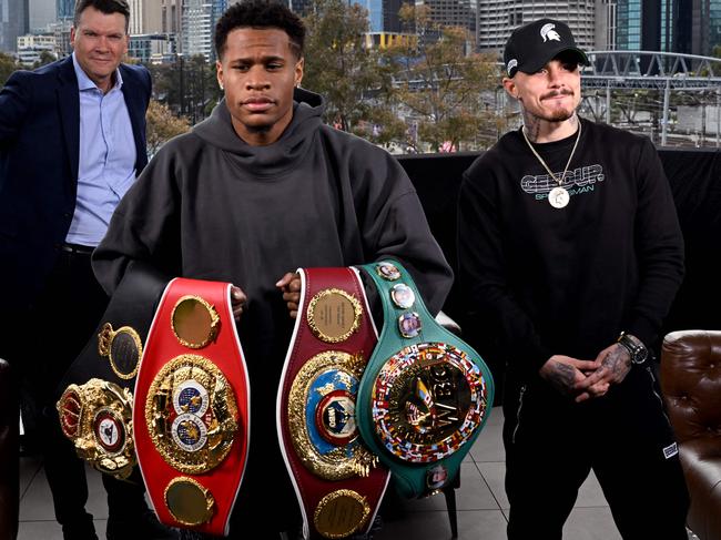 Devin Haney of the US (C) holds his title belts after a face-off with Australia's George Kambosos in Melbourne. Picture: William West/AFP