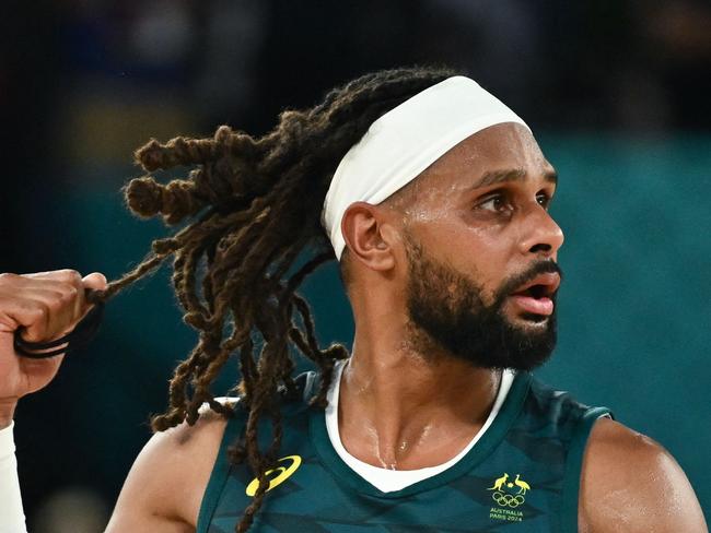 Australia's #05 Patty Mills reacts after in the men's quarterfinal basketball match between Serbia and Australia during the Paris 2024 Olympic Games at the Bercy  Arena in Paris on August 6, 2024. (Photo by Aris MESSINIS / AFP)