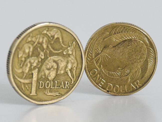 An Australian Dollar coin and a New Zealand Dollar coin are pictured in Canberra, Tuesday, April 07, 2015. The New Zealand dollar is almost level with the Aussie dollar for the first time since the floating of the currencies. (AAP Image/Lukas Coch) NO ARCHIVING