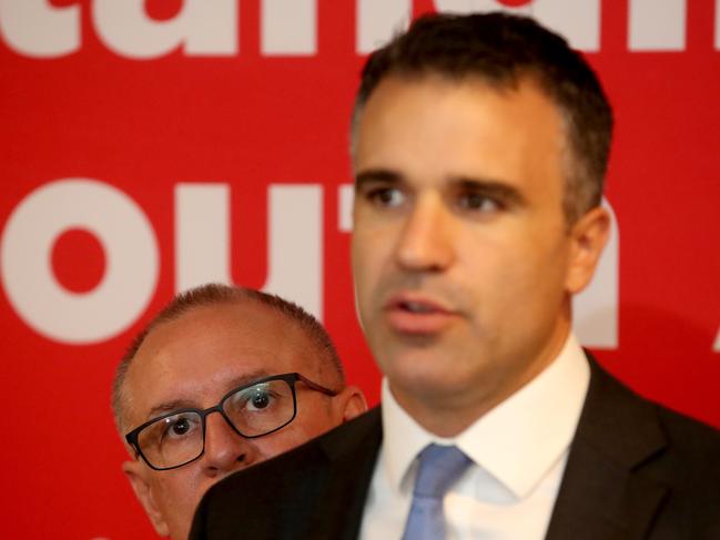 South Australian Premier Jay Weatherill (left) watches on as Minister for Health Peter Malinauskas speaks at a media conference to announce a Mental Health policy in Adelaide, Tuesday, February 27, 2018. (AAP Image/Kelly Barnes) NO ARCHIVING