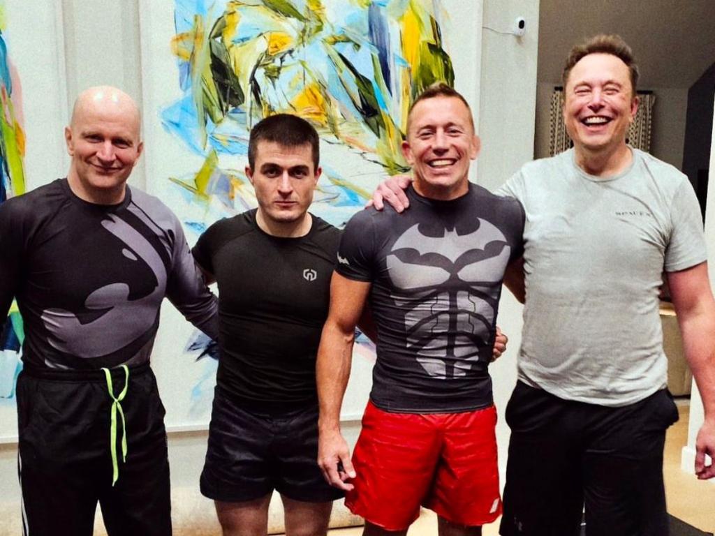 Elon Musk (R) had a training session with Georges St Pierre (red shorts) at his gym in July. Source: Twitter
