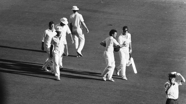 Whitney and McDermott leave the field at the MCG after an impossible job well done.