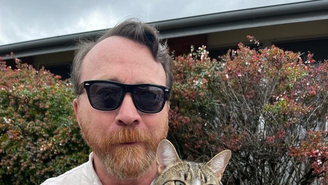 Boat and his support cat Bandit voting in Monaro. Picture: Julia Kanapathippillai