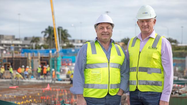 Queensland Airports Limited executive general manager property and infrastructure Carl Bruhn (left) and Condev Construction executive chairman Steve Marais in front of the slab now laid for the Gold Coast Airport's first hotel, a $50 million Rydges scheduled to open mid-2020. Picture: Fotomedia