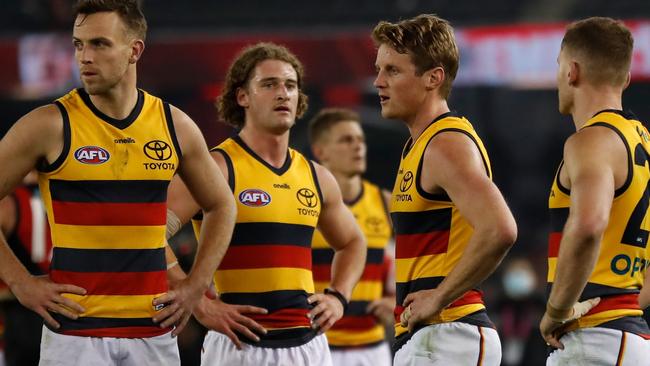 Crows look dejected after a terrible loss to the hands of the Bombers. Picture: AFL Photos via Getty Images