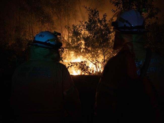 Firefighters monitor the fire as it burns. Picture: Liam Mendes