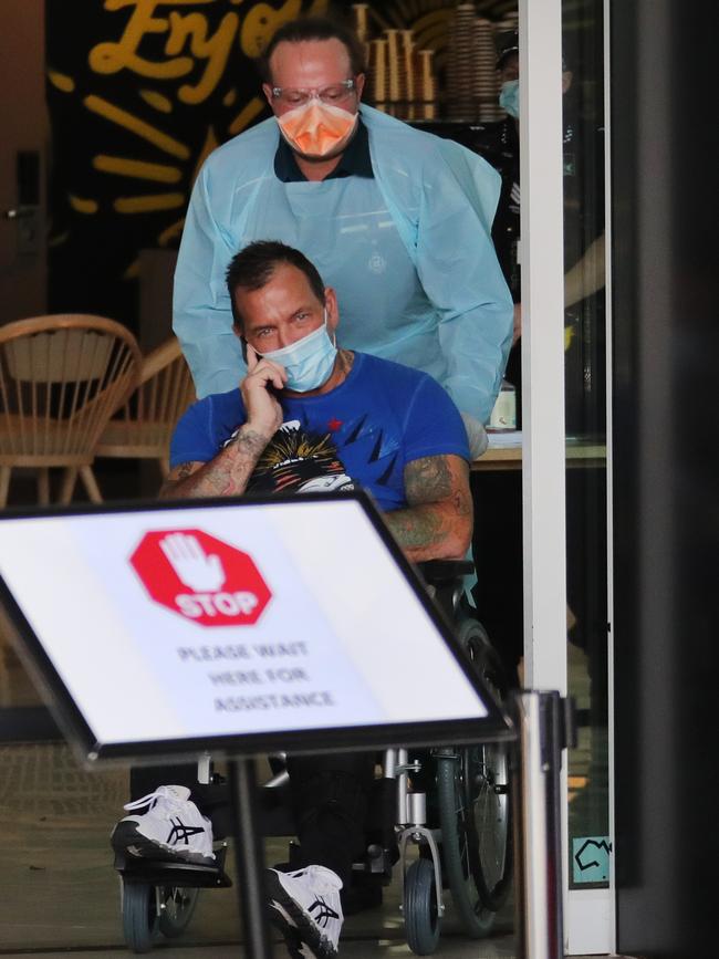 Shane Bowden on Tuesday being wheeled from a hotel to a Gold Coast hospital.