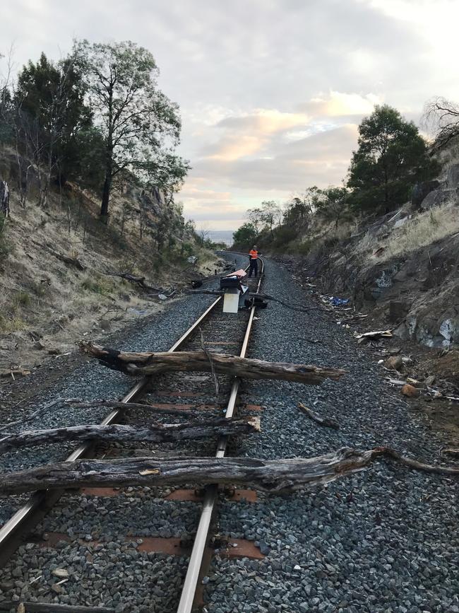 TasRail images of debris left on and around train tracks.