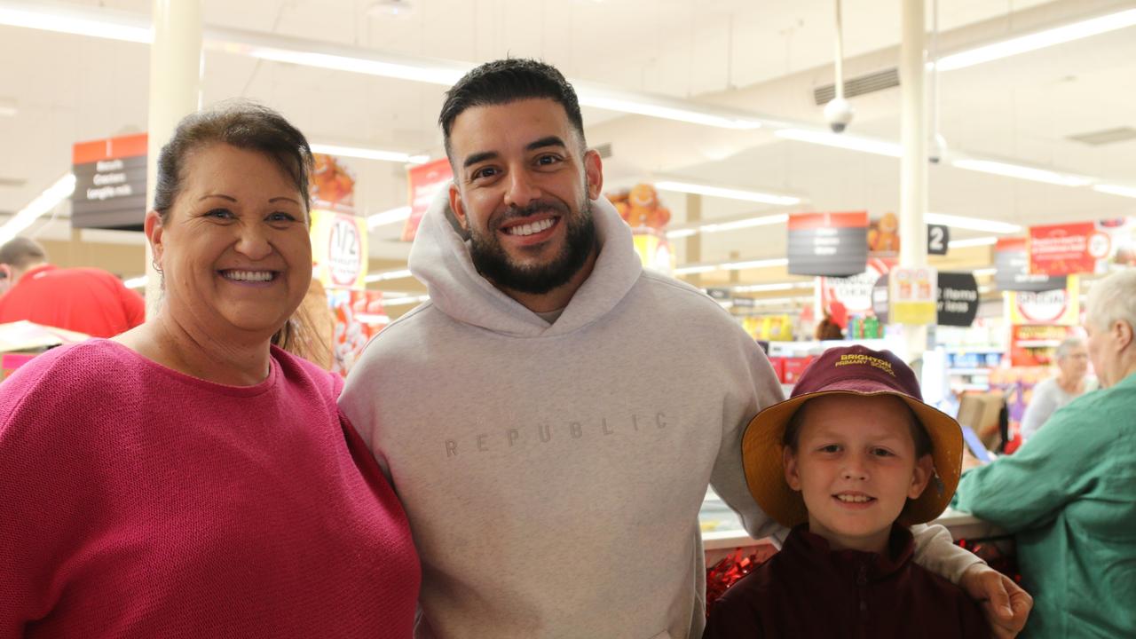 Helen Johnson, Adrian Portelli and her grandson after receiving a Coles gift voucher at Northgate. Picture: Elise Kaine