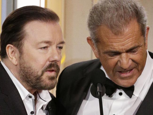 BEVERLY HILLS, CA - JANUARY 10: In this handout photo provided by NBCUniversal, Host Ricky Gervais and presenter Mel Gibson speak onstage during the 73rd Annual Golden Globe Awards at The Beverly Hilton Hotel on January 10, 2016 in Beverly Hills, California. (Photo by Paul Drinkwater/NBCUniversal via Getty Images)