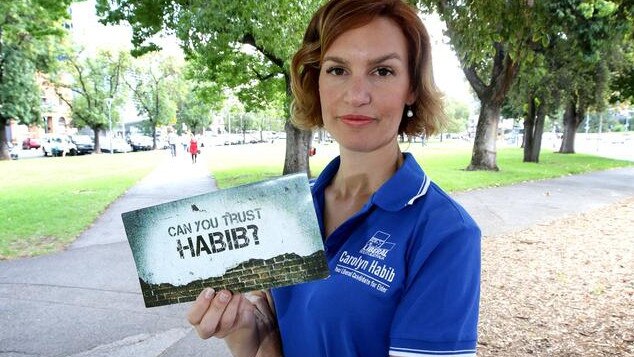 Liberal candidate Carolyn Habib (now Power) holding the offensive Labor leaflet at the 2014 SA election.