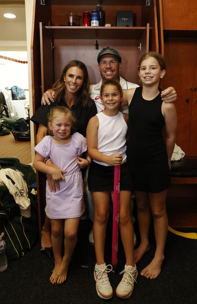 ‘I’m incredibly proud!’ Candice and David Warner with their three daughters inside the SCG locker rooms in January of last year. Picture: Getty Images