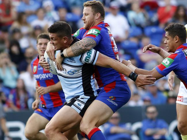 Korbin Sims tackles Chris Heighington.