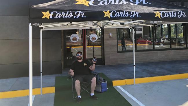 Dave Wilson was proud to be first in line for the opening of the Carl's Jr outlet at Eagleby in September. Picture: Supplied/Carl’s Jr