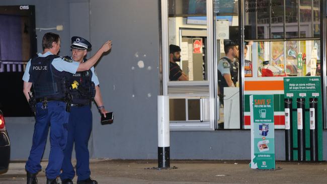 Officers investigating. Picture: Bill Hearne