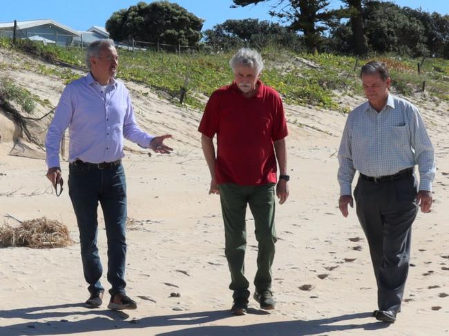 Clarence Nationals MP Chris Gulaptis, Wooli Coastal Community Protection Alliance representative and Clarence Valley Mayor Jim Simmons walking in front of the successful sand and dune nourishment project at Wooli Beach discussing its success and plans for the next beach scraping project which will provide further protection. Photo: Debbie Newton