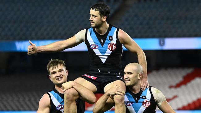 Boak was chaired off by Sam Powell-Pepper and Ollie Wines. Picture: Quinn Rooney/Getty Images