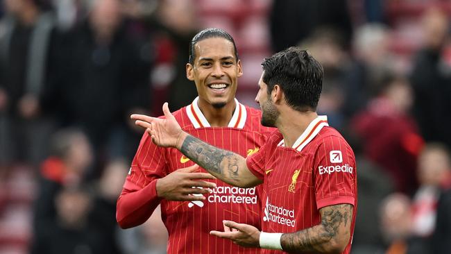 Dominik Szoboszlai of Liverpool interacts with Virgil van Dijk of Liverpool after the Premier League match between Liverpool FC and Brentford FC at Anfield on August 25, 2024 in Liverpool, England. (Photo by Michael Regan/Getty Images)